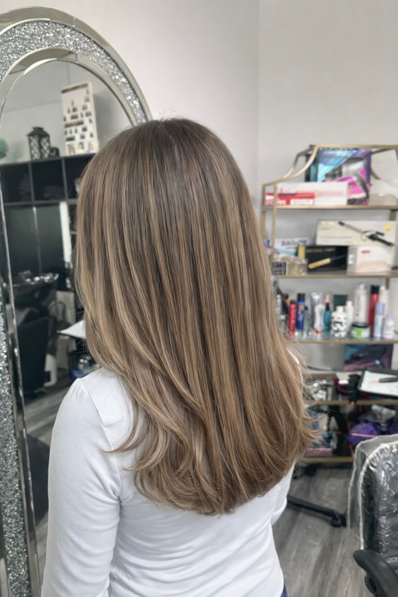 Bronde balayage highlights blended through dark brown mid-length hair