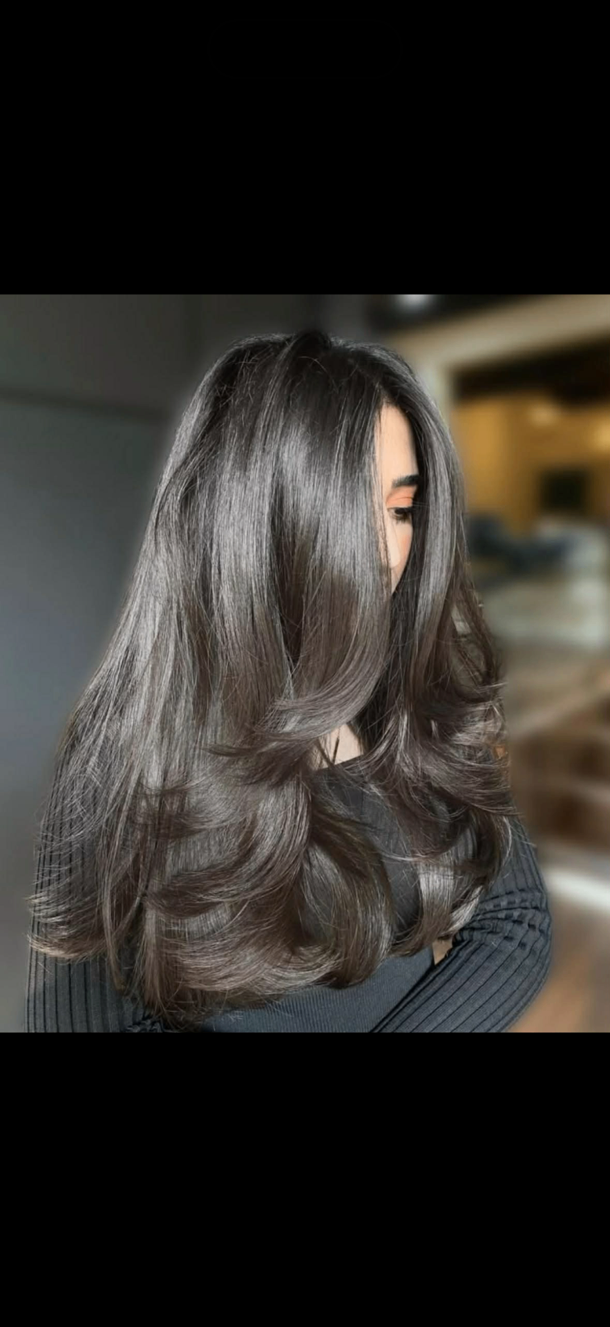 Long brunette layered blowout with bouncy round-brush ends